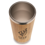 Branded Bamboo tumbler with metal rim and Eden Organics logo on a white background