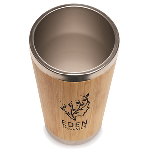 Branded Bamboo tumbler with metal rim and Eden Organics logo on a white background