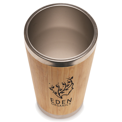 Branded Bamboo tumbler with metal rim and Eden Organics logo on a white background